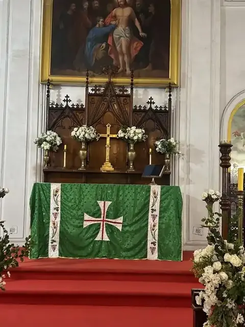 Church altar dressed with white flowers